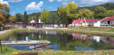 Lisboa Springs Fish Hatchery — the show pond and red-roofed buildings along NM Highway 63 in Pecos, New Mexico