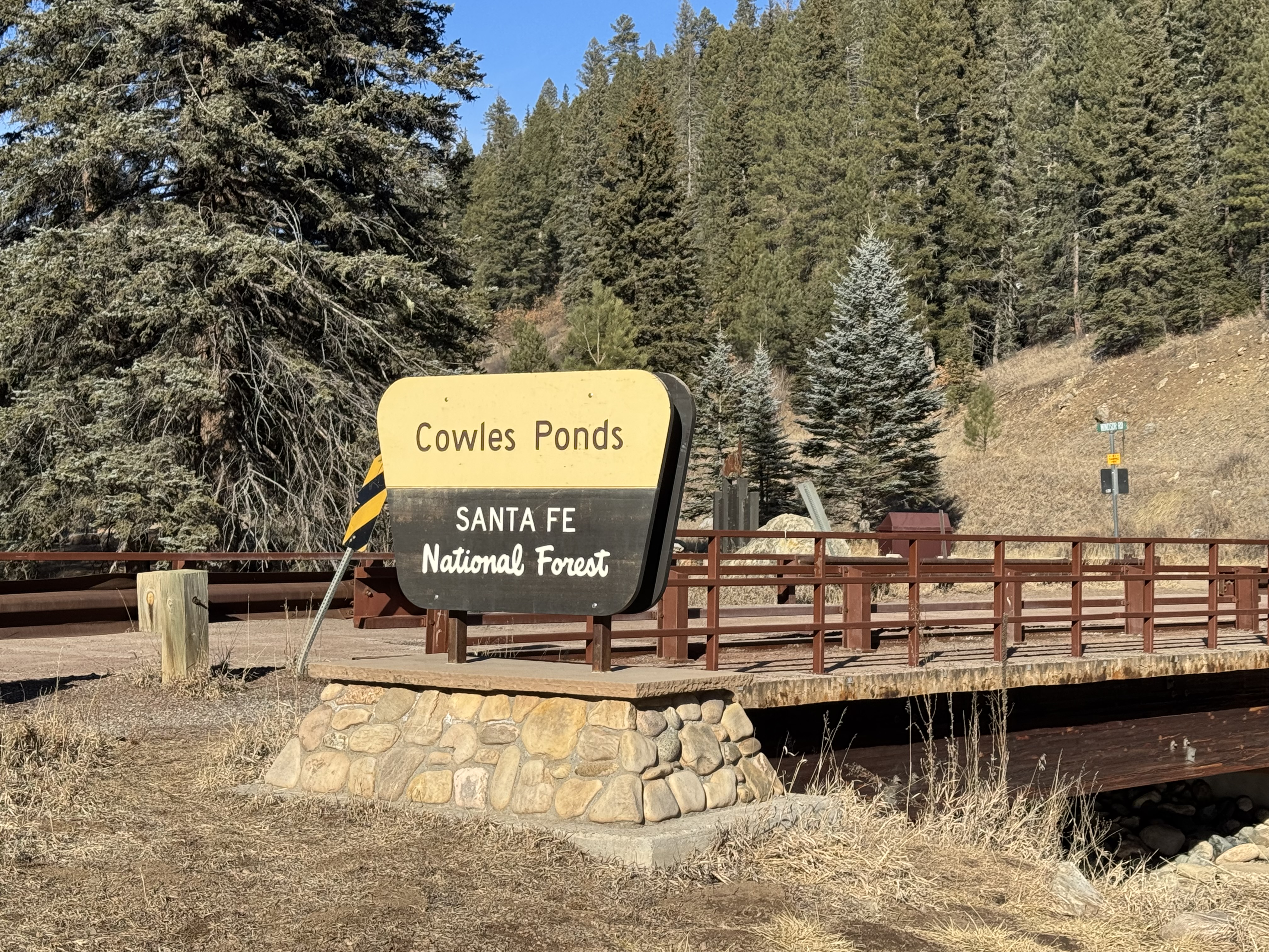 Cowles Ponds Santa Fe National Forest sign with bridge